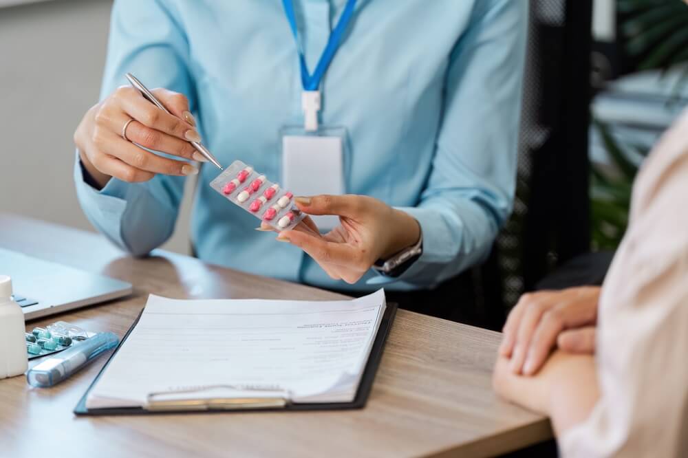 Healthcare professional discusses medication options with a patient